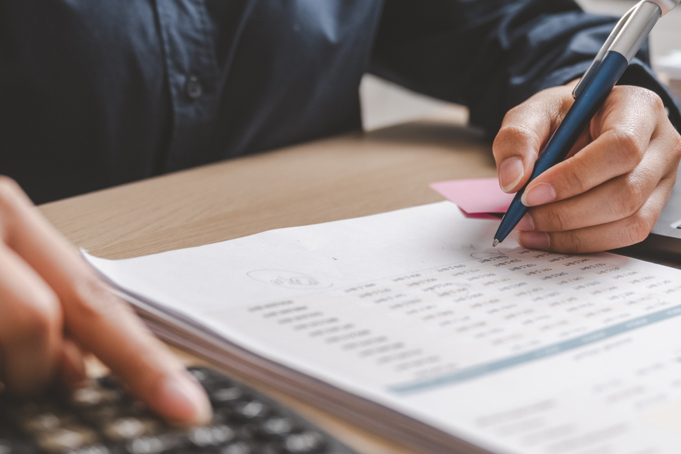 Crew management participant writing about financial matters at Watermark – maritime crew management